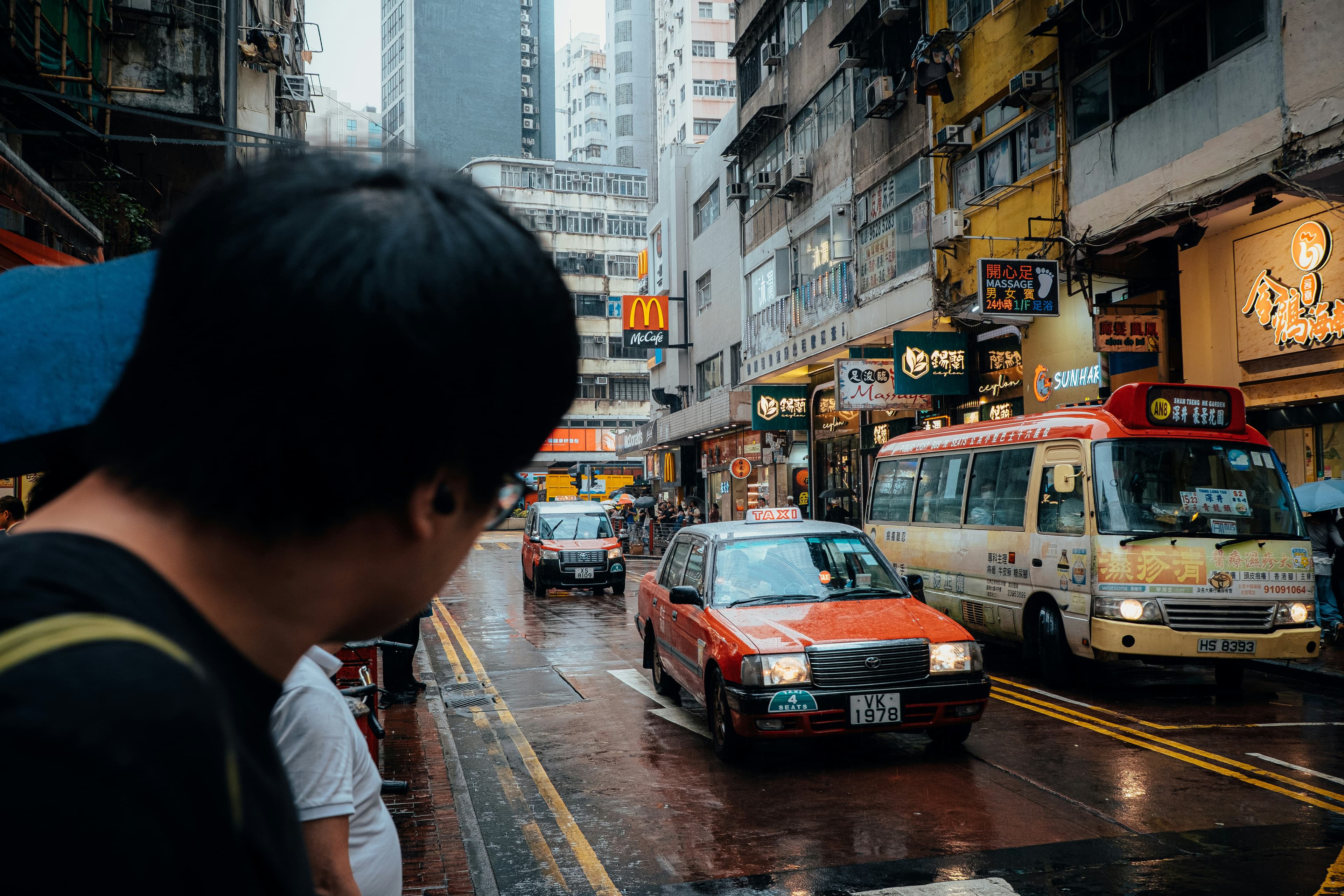 A man trying to cross the street, kudos to the photographer, Desmond Leung.